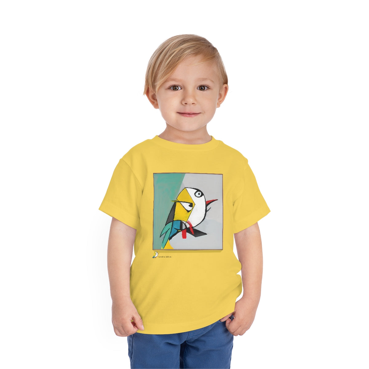 A child wearing the Rare Cubist Bird toddler t-shirt in Yellow