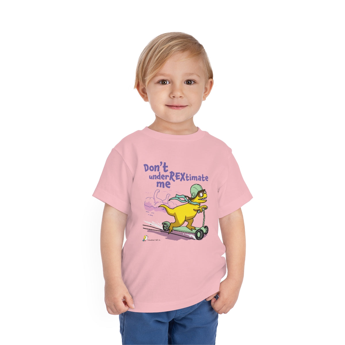 A child wearing the Don't UnderREXtimate Me toddler t-shirt in Pink