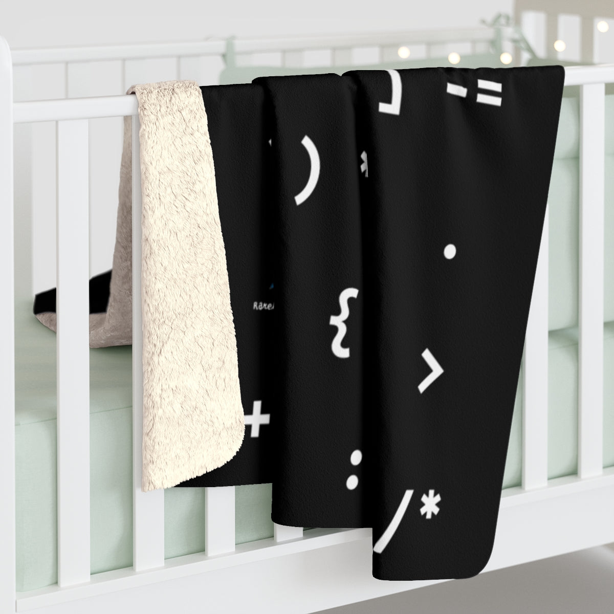 A chic and cozy blanket introducing code to kids, to spark an interest in math and software, smart STEM gift featuring symbols used in programming languages